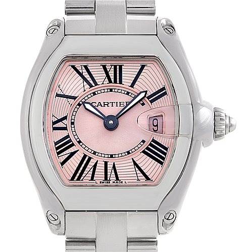 The Cartier Roadster W62017V3 Women's Stainless Steel Pink Dial W62017V3 Women's Stainless Steel Pink Dial watch is shown from a front angle, displaying its face with Roman numerals, date window, and steel bracelet.