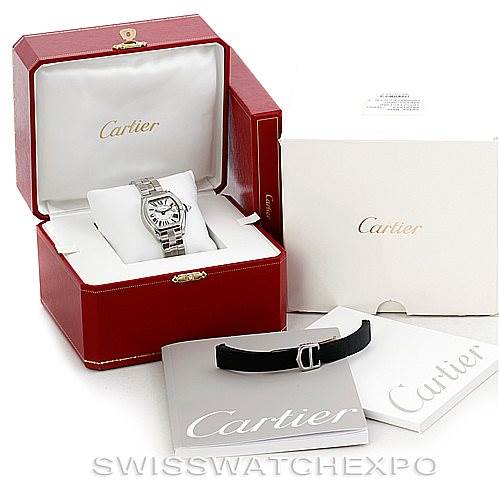 The image shows the Cartier Roadster W62016V3 Women's Stainless Steel Silver Dial W62016V3 Women's Stainless Steel Silver Dial watch in its box with additional accessories and documents.
