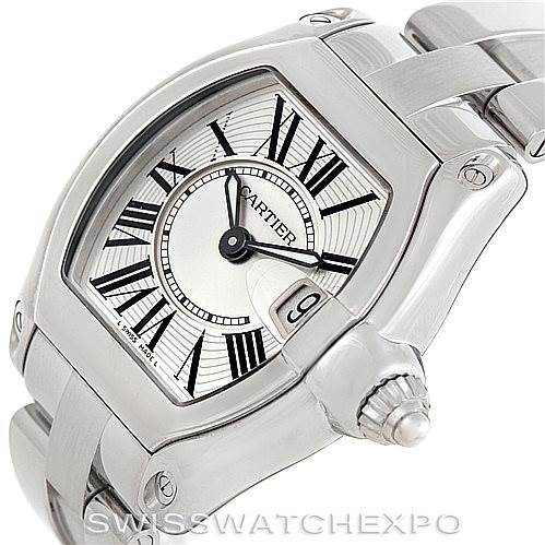 This image shows a Cartier Roadster W62016V3 Women's Stainless Steel Silver Dial W62016V3 Women's Stainless Steel Silver Dial watch from an angle displaying the face, crown, and part of the bracelet.