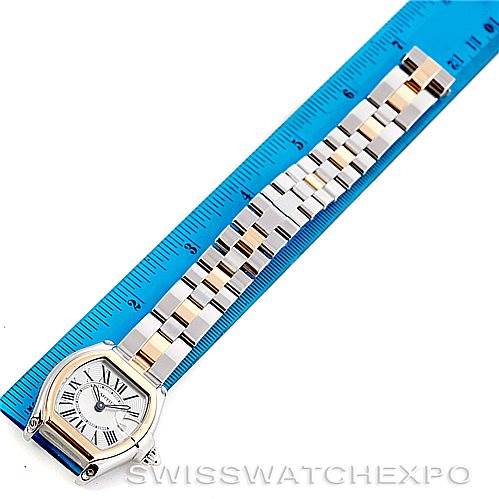 The image shows a Cartier Roadster W62026Y4 Women's Steel and Gold (two tone) Silver Dial W62026Y4 Women's Steel and Gold (two tone) Silver Dial model watch, with the face, bracelet, and a ruler indicating the length.