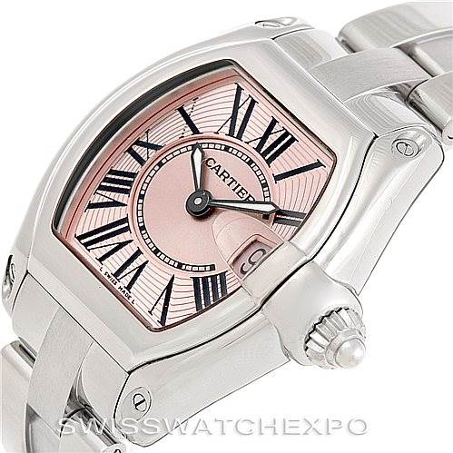 This image shows a close-up of the Cartier Roadster W62017V3 Women's Stainless Steel Pink Dial W62017V3 Women's Stainless Steel Pink Dial watch, focusing on its dial, crown, and part of the bracelet.