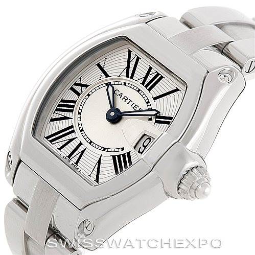 The image shows a close-up view of the Cartier Roadster W62016V3 Women's Stainless Steel Silver Dial W62016V3 Women's Stainless Steel Silver Dial watch, focusing on its face, crown, and part of the metal bracelet.