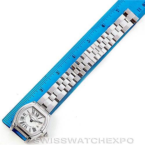 The image shows a top view of the Cartier Roadster W62016V3 Women's Stainless Steel Silver Dial W62016V3 Women's Stainless Steel Silver Dial watch beside a ruler, displaying the watch face, case, and metal bracelet band.