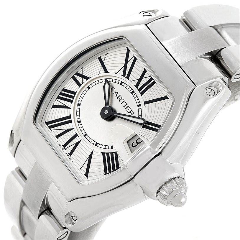 The image shows a close-up of the Cartier Roadster W62016V3 Women's Stainless Steel Silver Dial W62016V3 Women's Stainless Steel Silver Dial watch, focusing on the dial, hands, crown, and part of the bracelet.