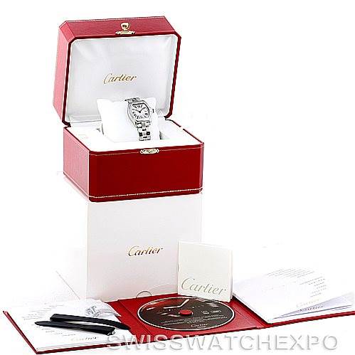 The image shows a Cartier Roadster W62016V3 Women's Stainless Steel Silver Dial W62016V3 Women's Stainless Steel Silver Dial watch in its open box with accompanying accessories, including manuals, a DVD, and a travel pouch.