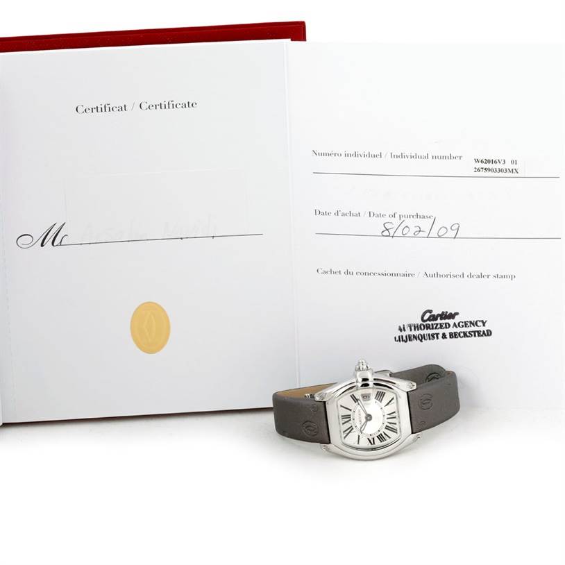 The Cartier Roadster W62016V3 Women's Stainless Steel Silver Dial W62016V3 Women's Stainless Steel Silver Dial watch is shown from a front angle along with its certificate and purchase documentation.