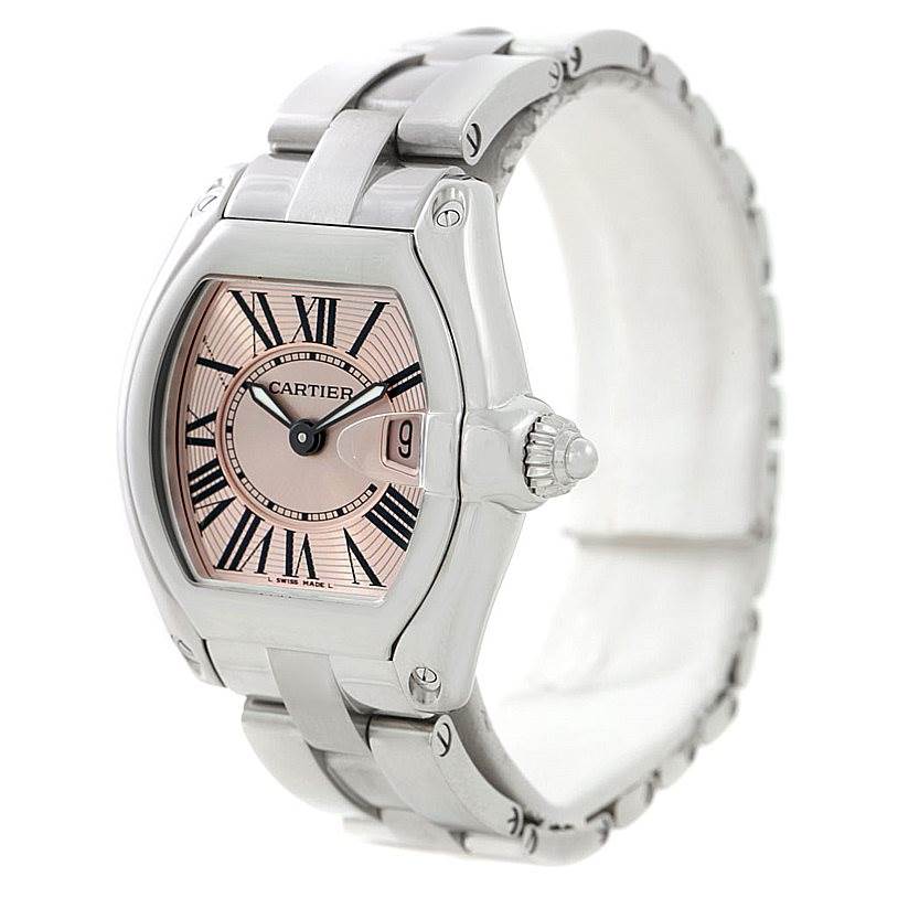 The Cartier Roadster W62017V3 Women's Stainless Steel Pink Dial W62017V3 Women's Stainless Steel Pink Dial watch is shown at an angle displaying the face, date window, crown, and part of the band.
