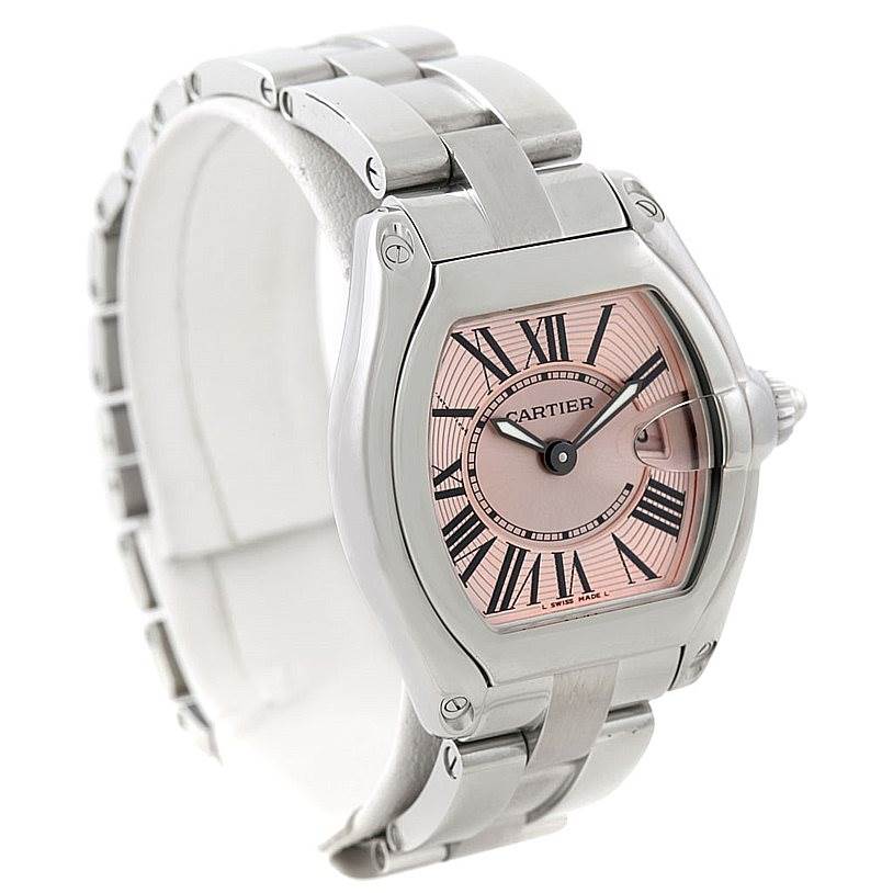 The Cartier Roadster W62017V3 Women's Stainless Steel Pink Dial W62017V3 Women's Stainless Steel Pink Dial watch is shown at a slight angle, capturing its face, case, and part of the bracelet.