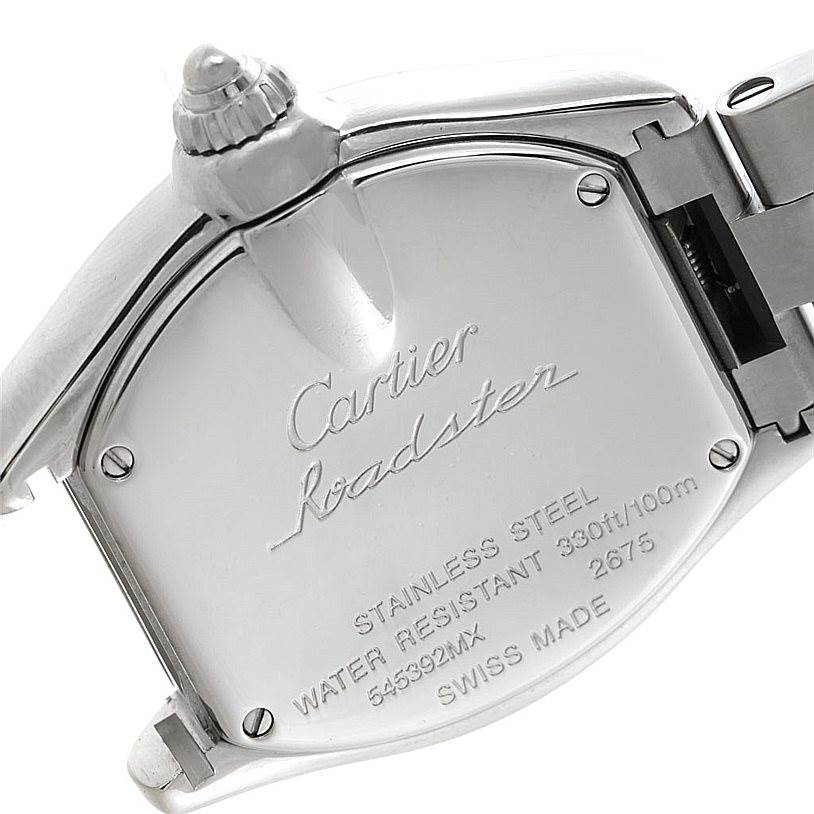 The image shows the back case of the Cartier Roadster W62053V3 Women's Stainless Steel Blue Dial W62053V3 Women's Stainless Steel Blue Dial watch, highlighting the engravings and part of the metal bracelet.