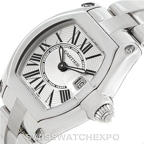 The image shows a close-up angle of a Cartier Roadster W62016V3 Women's Stainless Steel Silver Dial W62016V3 Women's Stainless Steel Silver Dial watch focusing on its dial, crown, and part of the bracelet.