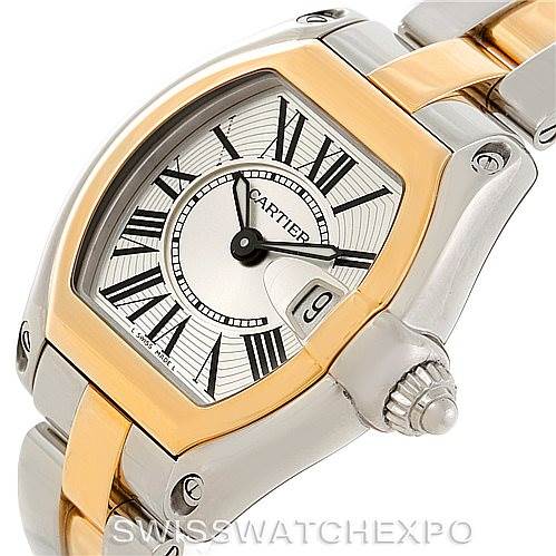 The Cartier Roadster W62026Y4 Women's Steel and Gold (two tone) Silver Dial W62026Y4 Women's Steel and Gold (two tone) Silver Dial watch is shown at a close-up angle, highlighting the face, bezel, and part of the bracelet.