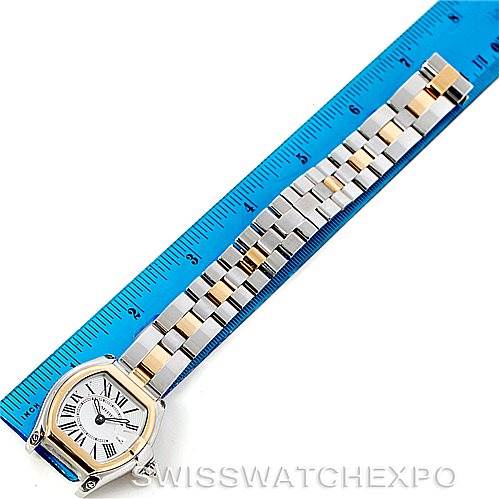 The Cartier Roadster W62026Y4 Women's Steel and Gold (two tone) Silver Dial W62026Y4 Women's Steel and Gold (two tone) Silver Dial watch is shown from above, displaying its face, case, and bracelet against a blue ruler for scale.