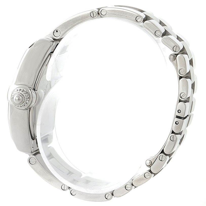 The Cartier Roadster W62054V3 Women's Stainless Steel Pink Dial W62054V3 Women's Stainless Steel Pink Dial watch is shown from the side, highlighting the crown and the metal bracelet.