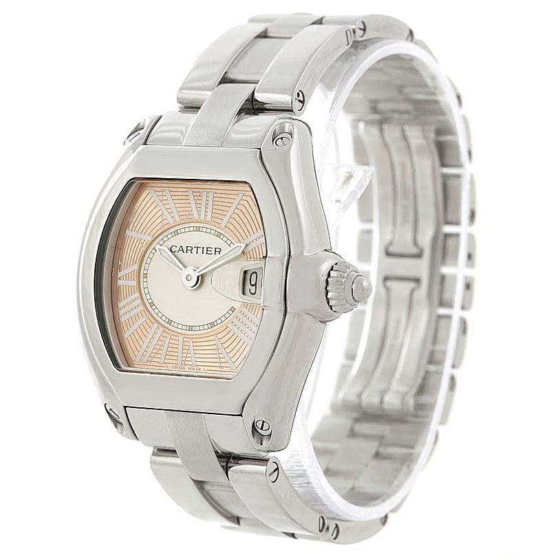 The image shows a front angled view of the Cartier Roadster W62054V3 Women's Stainless Steel Pink Dial W62054V3 Women's Stainless Steel Pink Dial watch, highlighting its dial, crown, and metal bracelet.