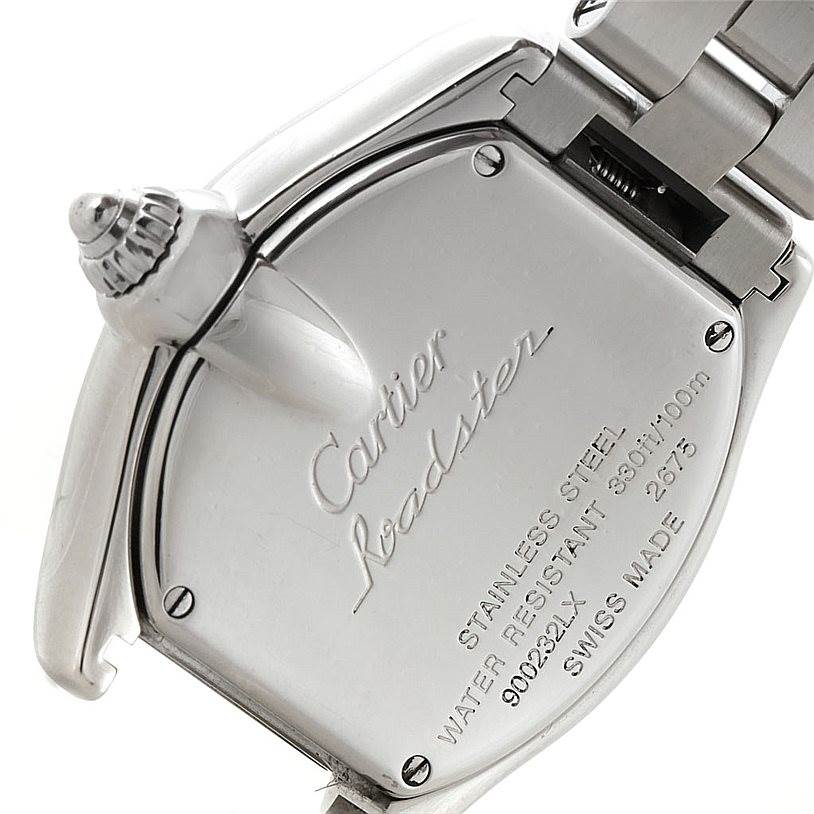 The image shows the back case and part of the bracelet of a Cartier Roadster W62054V3 Women's Stainless Steel Pink Dial W62054V3 Women's Stainless Steel Pink Dial watch, highlighting the engravings and metal construction.