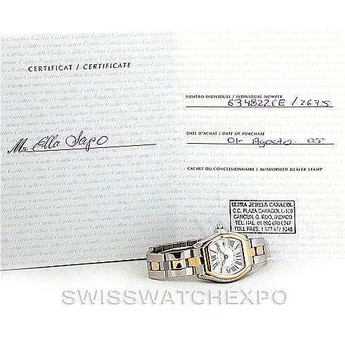 The image shows a Cartier Roadster W62026Y4 Women's Steel and Gold (two tone) Silver Dial W62026Y4 Women's Steel and Gold (two tone) Silver Dial watch in a flat position with its certificate, displaying the face and bracelet.