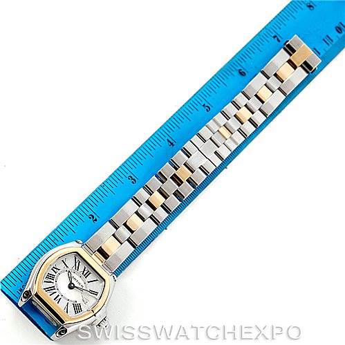 This image shows a Cartier Roadster W62026Y4 Women's Steel and Gold (two tone) Silver Dial W62026Y4 Women's Steel and Gold (two tone) Silver Dial watch face and full bracelet, measured against a blue ruler.