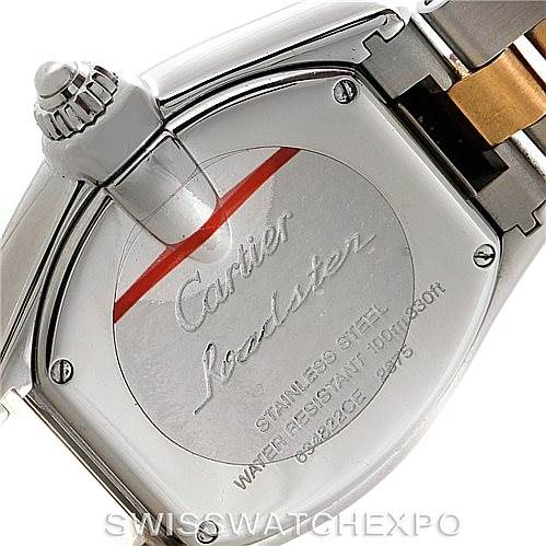 The image shows the case back and crown of the Cartier Roadster W62026Y4 Women's Steel and Gold (two tone) Silver Dial W62026Y4 Women's Steel and Gold (two tone) Silver Dial watch at an angle, highlighting the engravings and stainless steel material.