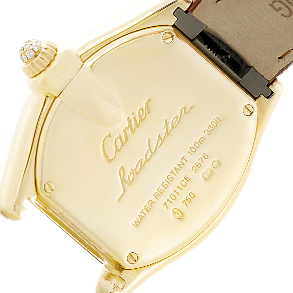 The image shows the backside of the Cartier Roadster WE500160 Women's Yellow Gold Silver Dial WE500160 Women's Yellow Gold Silver Dial watch, focusing on the engraved details and strap connection.