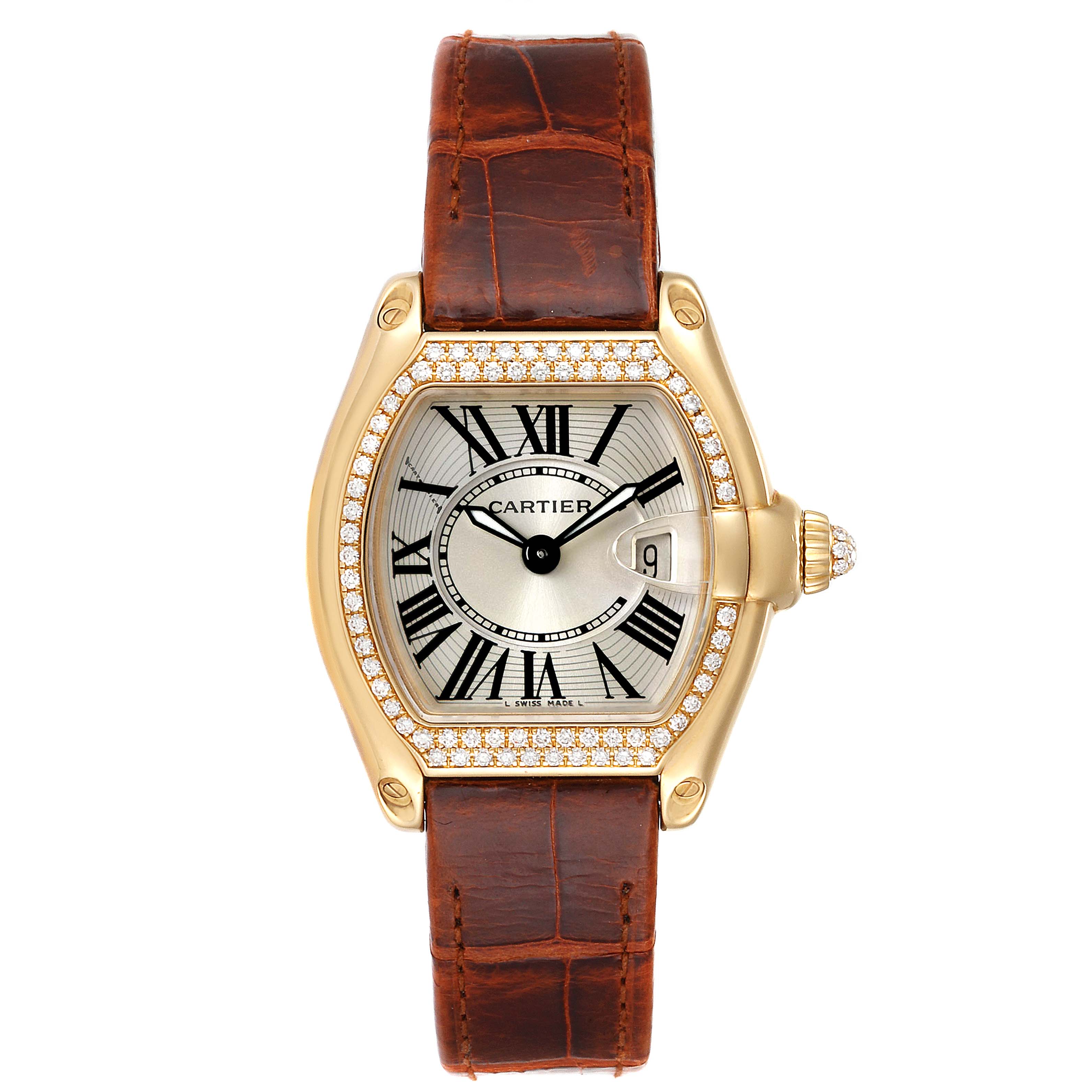The image shows a front view of a Cartier Roadster WE500160 Women's Yellow Gold Silver Dial WE500160 Women's Yellow Gold Silver Dial watch with a brown leather strap and a diamond-encrusted gold case.