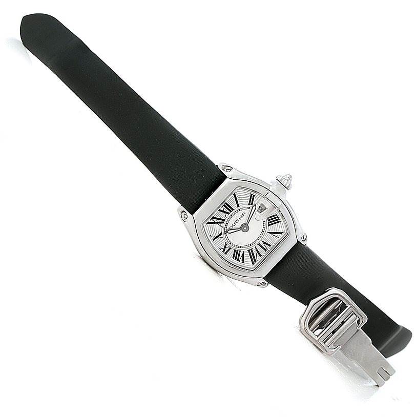 The Cartier Roadster W62016V3 Women's Stainless Steel Silver Dial W62016V3 Women's Stainless Steel Silver Dial watch is shown at an angled top-down view, displaying its face and partially open clasp.