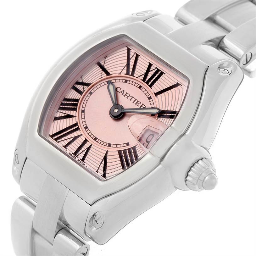 This image shows a close-up angle of the Cartier Roadster W62017V3 Women's Stainless Steel Pink Dial W62017V3 Women's Stainless Steel Pink Dial watch, highlighting its pink dial, Roman numerals, and metallic bracelet.