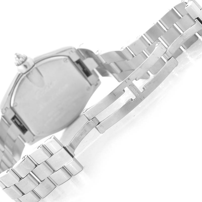 The image shows the back of the Cartier Roadster W62017V3 Women's Stainless Steel Pink Dial W62017V3 Women's Stainless Steel Pink Dial's casing and partially opened stainless steel bracelet.