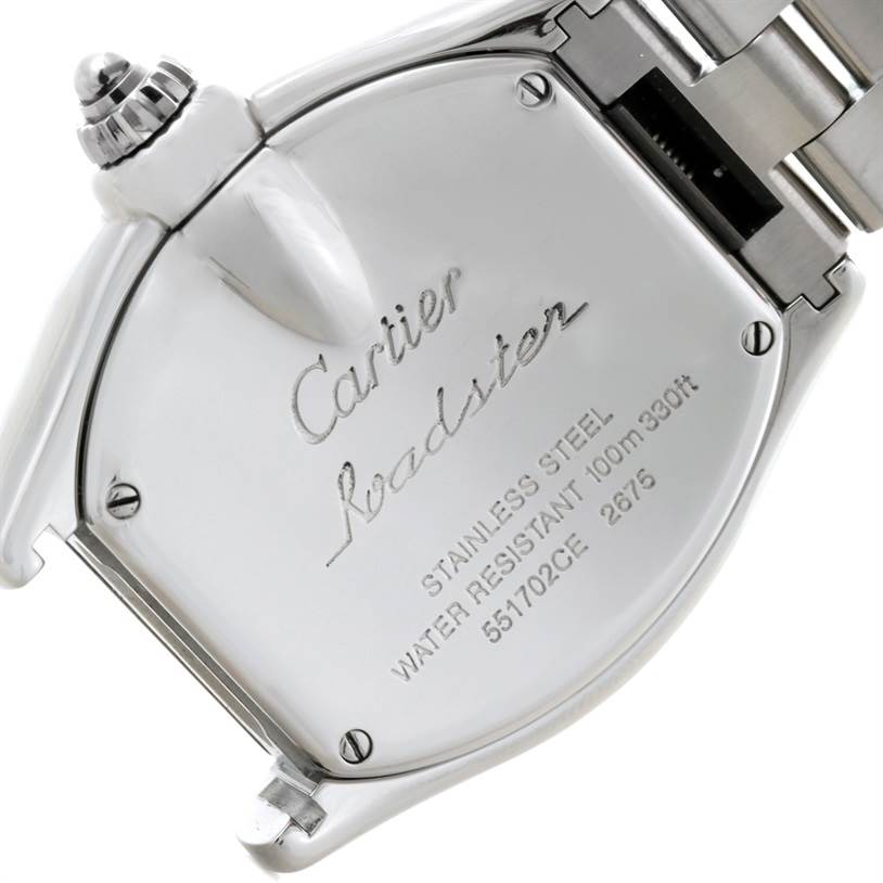 The image shows the back case and crown of a Cartier Roadster W62016V3 Women's Stainless Steel Silver Dial W62016V3 Women's Stainless Steel Silver Dial watch, focused on its engraved details.