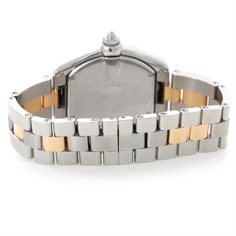 The image shows the back and part of the bracelet of a Cartier Roadster W62026Y4 Women's Steel and Gold (two tone) Silver Dial W62026Y4 Women's Steel and Gold (two tone) Silver Dial watch.