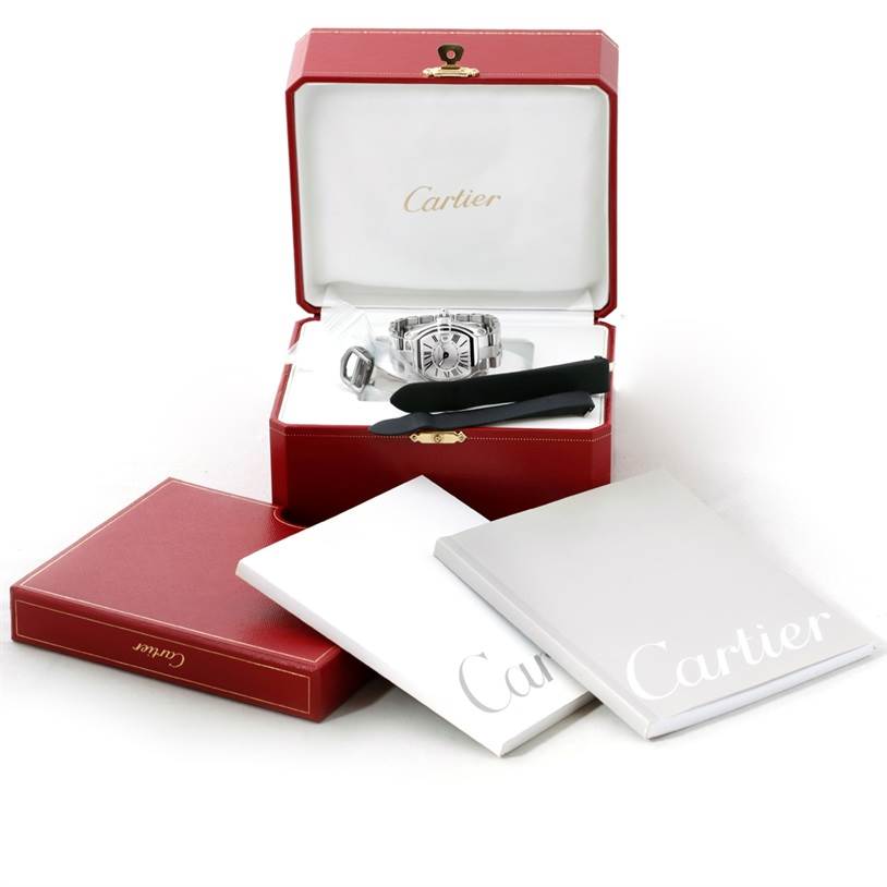 The photo shows a Cartier Roadster W62016V3 Women's Stainless Steel Silver Dial W62016V3 Women's Stainless Steel Silver Dial watch, its case, accessories, and documentation from a front angle.