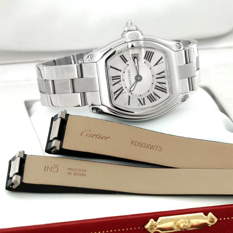 The image shows a Cartier Roadster W62016V3 Women's Stainless Steel Silver Dial W62016V3 Women's Stainless Steel Silver Dial watch at a front angle along with two leather watch straps.