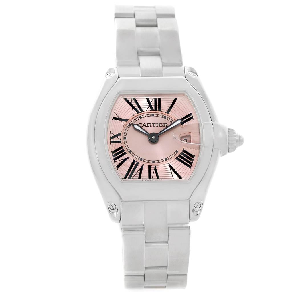 The image shows a front view of the Cartier Roadster W62017V3 Women's Stainless Steel Pink Dial W62017V3 Women's Stainless Steel Pink Dial watch, highlighting its pink dial, Roman numerals, and metal bracelet.