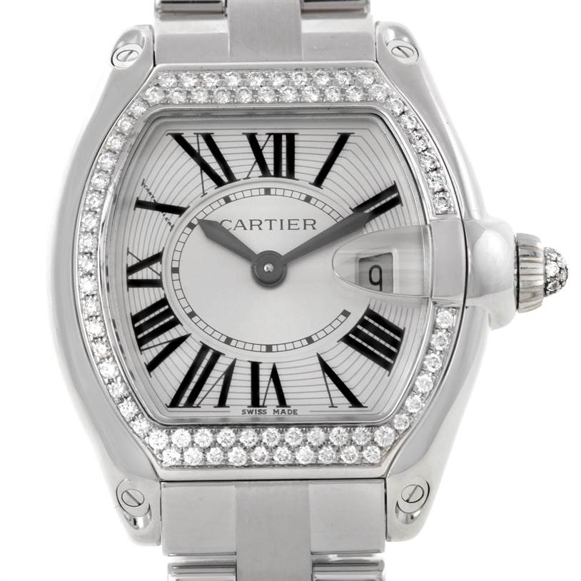 The image shows a close-up of the Cartier Roadster WE5002X2 Women's White Gold Silver Dial WE5002X2 Women's White Gold Silver Dial watch face, highlighting the bezel, dial, hands, and crown.