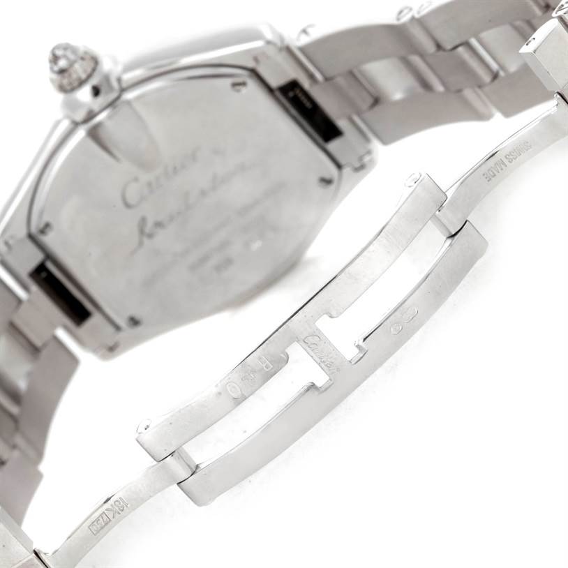 The image shows the backside and metal bracelet clasp of a Cartier Roadster WE5002X2 Women's White Gold Silver Dial WE5002X2 Women's White Gold Silver Dial watch, highlighting the engraved details.