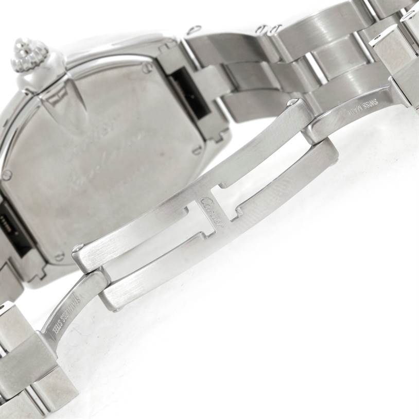 The image shows the clasp and part of the stainless steel bracelet of a Cartier Roadster W62016V3 Women's Stainless Steel Silver Dial W62016V3 Women's Stainless Steel Silver Dial watch at an angle.