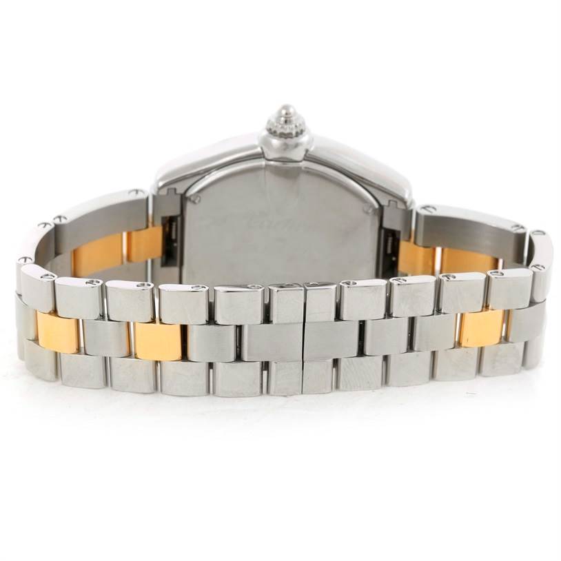 This image shows the back view of a Cartier Roadster W62026Y4 Women's Steel and Gold (two tone) Silver Dial W62026Y4 Women's Steel and Gold (two tone) Silver Dial watch focusing on its two-tone metal bracelet and the case back.
