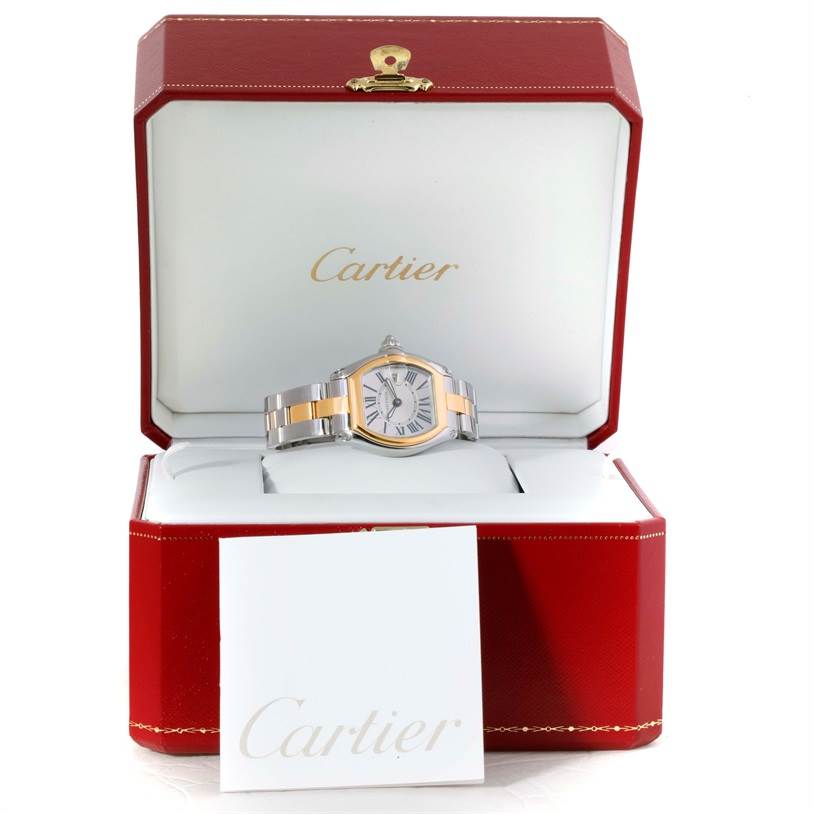 This Cartier Roadster W62026Y4 Women's Steel and Gold (two tone) Silver Dial W62026Y4 Women's Steel and Gold (two tone) Silver Dial watch is shown front-on, displayed in its branded red box with white interior and a booklet.