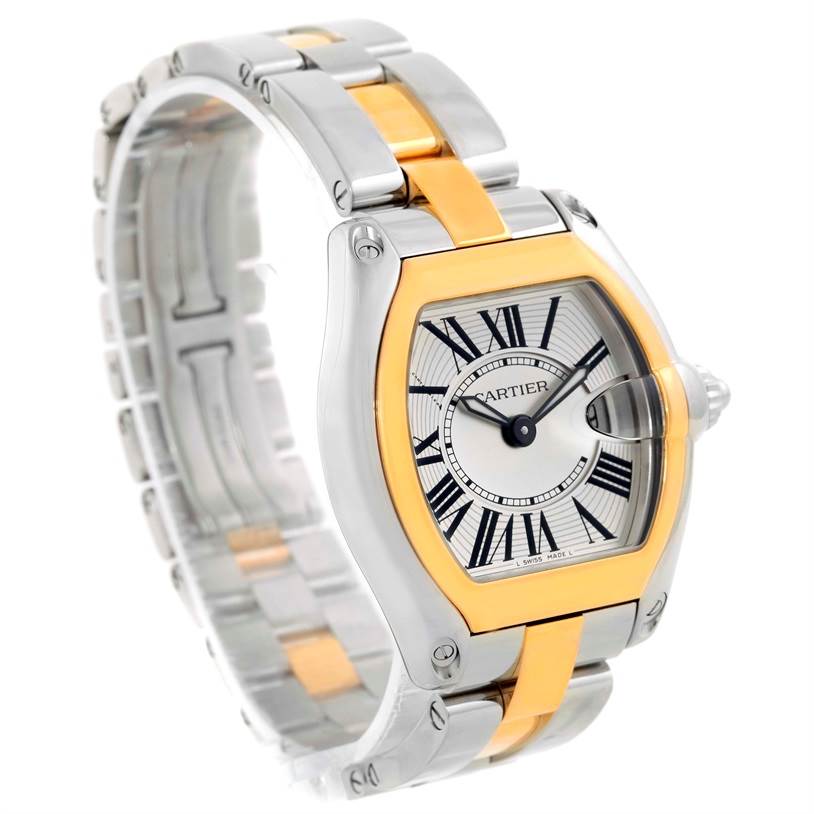 The Cartier Roadster W62026Y4 Women's Steel and Gold (two tone) Silver Dial W62026Y4 Women's Steel and Gold (two tone) Silver Dial watch is shown at an angle, highlighting its face, bezel, and two-tone metal strap.