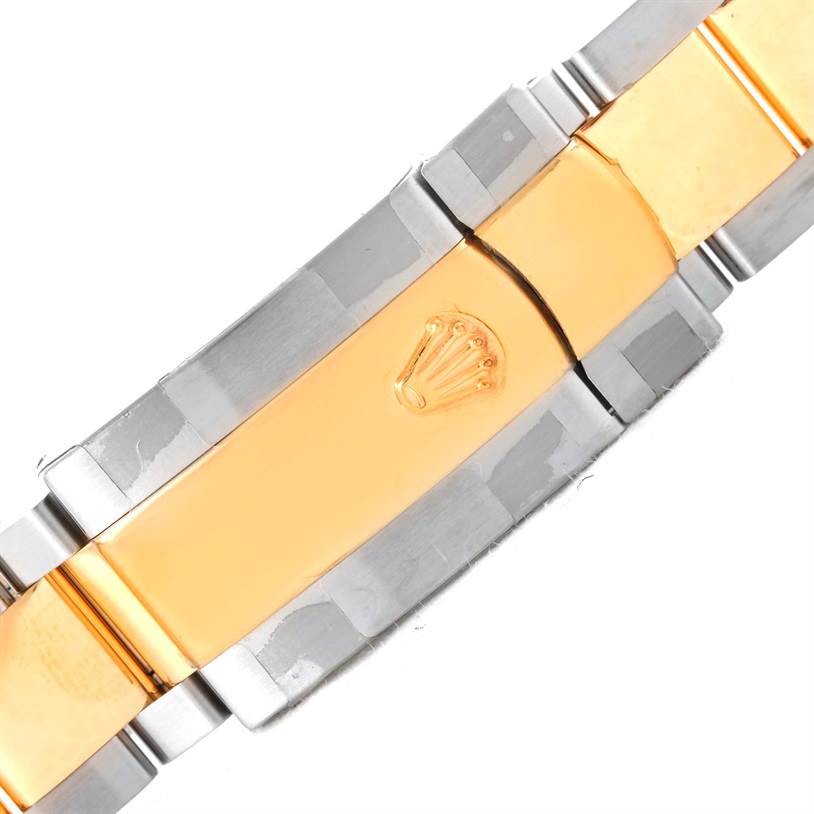 This is a close-up view of the Rolex Turn-o-Graph 116263 Men's Steel and Gold (two tone) White Dial 116263 Men's Steel and Gold (two tone) White Dial watch bracelet clasp with a blend of gold and silver tones.