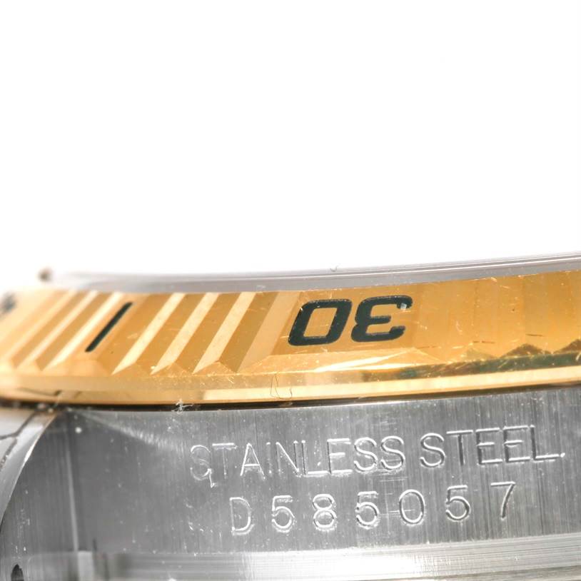 This image shows a close-up angle of the casing and gold bezel with numbering on a Rolex Turn-o-Graph 116263 Men's Steel and Gold (two tone) White Dial 116263 Men's Steel and Gold (two tone) White Dial watch.