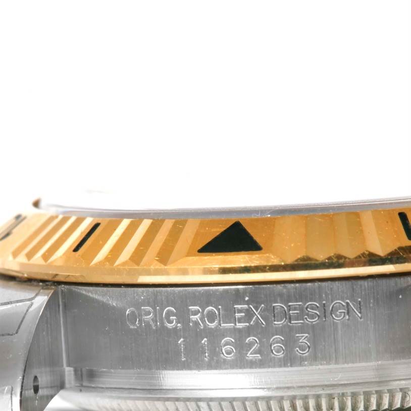 The image shows a close-up side view of the Rolex Turn-o-Graph 116263 Men's Steel and Gold (two tone) White Dial 116263 Men's Steel and Gold (two tone) White Dial watch, focusing on the bezel and engraved case side.