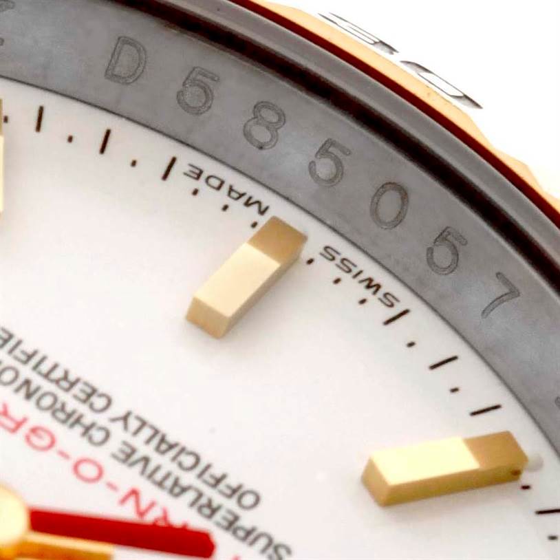 The image shows the dial and a portion of the bezel of a Rolex Turn-o-Graph 116263 Men's Steel and Gold (two tone) White Dial 116263 Men's Steel and Gold (two tone) White Dial watch, highlighting the markers and text "Swiss Made."