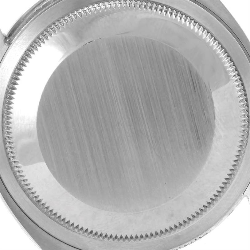 The image shows the caseback of a Rolex Turn-o-Graph 116264 Men's Stainless Steel White Dial 116264 Men's Stainless Steel White Dial watch from a top-down angle.