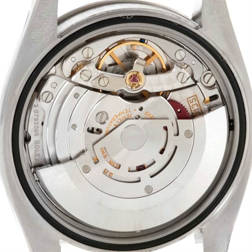This image shows the movement and inner mechanism of a Rolex Turn-o-Graph 116264 Men's Stainless Steel White Dial 116264 Men's Stainless Steel White Dial watch from a rear angle with the case back removed.