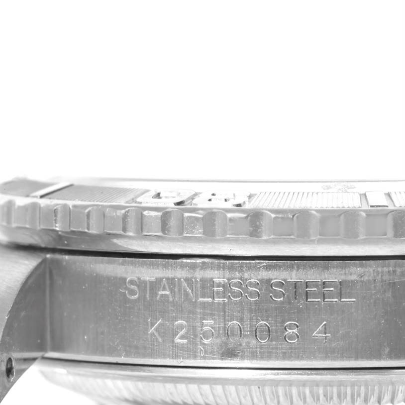 This is a close-up side view of the bezel and case side of the Rolex Turn-o-Graph 16264 Men
s Stainless Steel White Dial 16264 Men
s Stainless Steel White Dial watch, showing the stainless steel inscription and serial number.