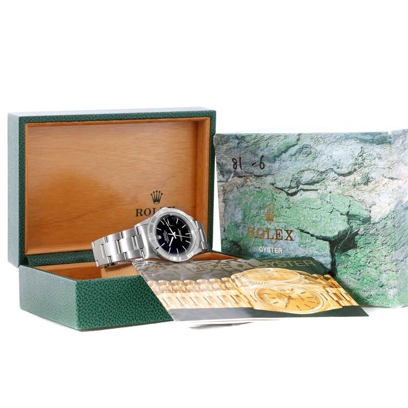 This image shows a Rolex Turn-o-Graph 16264 Men's Stainless Steel Black Dial 16264 Men's Stainless Steel Black Dial watch at a side angle with its box and accompanying booklet.