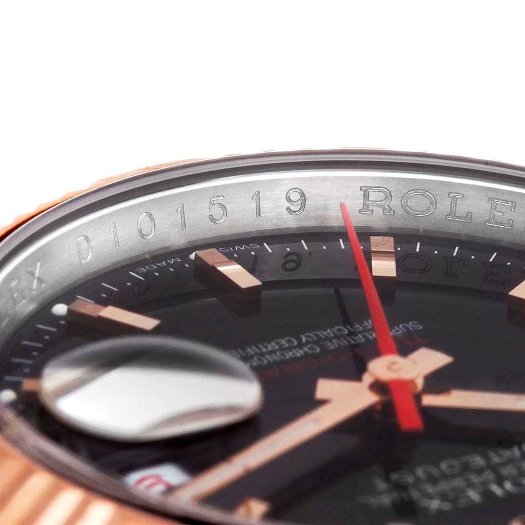 Close-up angle of the Rolex Turn-o-Graph 116261 Men's Stainless Steel Black Dial 116261 Men's Stainless Steel Black Dial watch showcasing the bezel, red second hand, and part of the date magnifier.