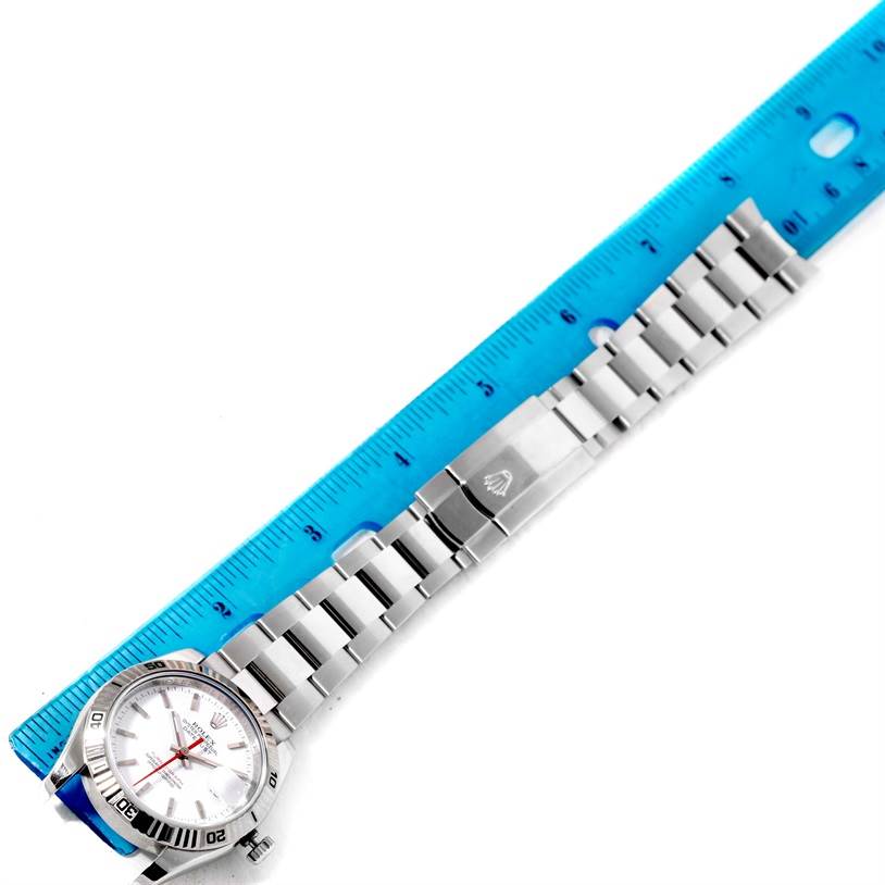 The image shows the Rolex Turn-o-Graph 116264 Men
s Stainless Steel White Dial 116264 Men
s Stainless Steel White Dial watch
s face and bracelet, laid flat next to a blue ruler for measurement.