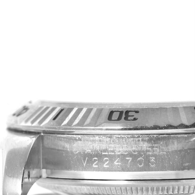 The image shows a close-up, side view of the bezel and stainless steel case of a Rolex Turn-o-Graph 116264 Men
s Stainless Steel White Dial 116264 Men
s Stainless Steel White Dial watch.