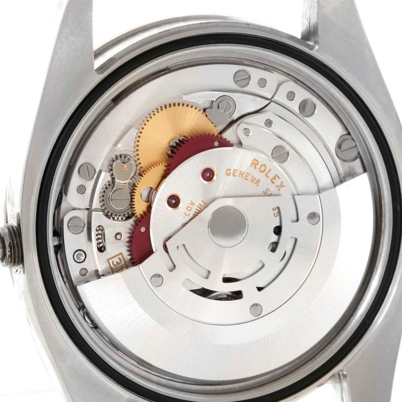 This image shows the open case back view of the Rolex Turn-o-Graph 116264 Men
s Stainless Steel White Dial 116264 Men
s Stainless Steel White Dial, revealing its internal movement and gears.